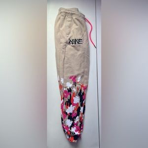 Tan Womens nike sweatpants with floral design